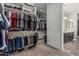 This large walk-in closet offers plenty of storage and organization with easy bathroom access at 1725 E Everglade Ln, Gilbert, AZ 85298