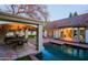 Poolside view with outdoor dining area and patio, showcasing an ideal setup for outdoor living and entertaining at 18 W Kaler Dr, Phoenix, AZ 85021