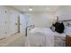 Modern bedroom features include a metal bed frame and ensuite bathroom at 18 W Kaler Dr, Phoenix, AZ 85021