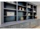 Stylish built-ins showcase decorative display shelves and lower storage drawers at 18 W Kaler Dr, Phoenix, AZ 85021