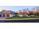 Charming home featuring a terra cotta roof, white stucco walls, and mature landscaping at 18 W Kaler Dr, Phoenix, AZ 85021