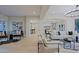 Expansive living area with elegant decor, wood floors, and open flow to the kitchen and dining spaces at 18 W Kaler Dr, Phoenix, AZ 85021