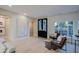 Spacious, open living area with wood floors, elegant decor, and abundant natural light at 18 W Kaler Dr, Phoenix, AZ 85021