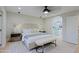 Comfortable main bedroom features a ceiling fan, stylish decor, and warm neutral colors at 18 W Kaler Dr, Phoenix, AZ 85021