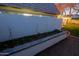 Picturesque side yard featuring a raised garden bed and manicured lawn space at 18 W Kaler Dr, Phoenix, AZ 85021