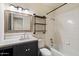 Bathroom with updated vanity, tub, and unique shelving at 1939 E Alameda Dr, Tempe, AZ 85282