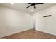 Bright bedroom features ceiling fan, recessed lighting, and wood-look vinyl plank flooring at 1939 E Alameda Dr, Tempe, AZ 85282
