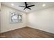 Bedroom featuring sleek flooring and a modern ceiling fan at 1939 E Alameda Dr, Tempe, AZ 85282