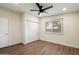 Bedroom features a ceiling fan, natural light, closet and modern vinyl plank flooring at 1939 E Alameda Dr, Tempe, AZ 85282