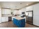 Modern kitchen features white cabinetry, stainless steel appliances, and island at 1939 E Alameda Dr, Tempe, AZ 85282
