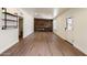Open-concept living room with sleek flooring and a distinctive wood accent wall at 1939 E Alameda Dr, Tempe, AZ 85282