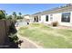 Lush backyard with a well-maintained lawn, swimming pool, and ample space for outdoor activities and relaxation at 20906 N 56Th Dr, Glendale, AZ 85308