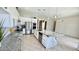Modern kitchen with a large island, stainless appliances, granite counters, and tiled floor at 20906 N 56Th Dr, Glendale, AZ 85308