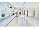 Bright, spacious kitchen with white cabinets, granite countertops, and stainless steel appliances at 20906 N 56Th Dr, Glendale, AZ 85308