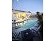 Inviting swimming pool at dusk, surrounded by patio furniture and lush landscaping, creating a tranquil retreat at 20906 N 56Th Dr, Glendale, AZ 85308
