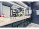 Bathroom with double sinks, decorative mirrors, and ample lighting, creating a soothing atmosphere at 2121 W Union Hills Dr # 113, Phoenix, AZ 85027