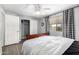 Bright bedroom showcasing gray walls, wood floors, and closet for storage solutions at 2121 W Union Hills Dr # 113, Phoenix, AZ 85027