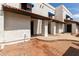 Charming townhome with a well-maintained exterior and inviting walkway to the front door at 2121 W Union Hills Dr # 113, Phoenix, AZ 85027