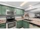 Efficient kitchen layout with updated appliances and plenty of counter space for cooking at 2121 W Union Hills Dr # 113, Phoenix, AZ 85027