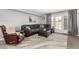 Comfortable living room with modern furniture and a door to an outdoor space at 2121 W Union Hills Dr # 113, Phoenix, AZ 85027