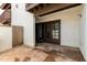 Inviting patio area with outdoor space and access to the house through brown glass doors at 2121 W Union Hills Dr # 113, Phoenix, AZ 85027