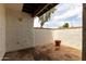 Charming patio with textured walls and sunny spot for plant pot at 2121 W Union Hills Dr # 113, Phoenix, AZ 85027