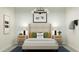 A bedroom features a racecar theme, complete with checkered wallpaper and playful decor, offering a fun and vibrant space at 23178 W Marguerite Ave, Buckeye, AZ 85326