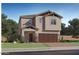 Charming two-story home featuring a two-car garage and well-manicured lawn at 23178 W Marguerite Ave, Buckeye, AZ 85326