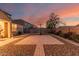 Expansive backyard showcasing a brick patio, gravel accents, and a basketball hoop at 2324 W Melody Dr, Phoenix, AZ 85041