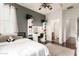 Stylish bedroom features a vanity with lighted mirror, gray accent wall, and soft, natural light at 2324 W Melody Dr, Phoenix, AZ 85041