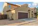 Two-story home with a two car garage, desert landscaping, and stucco exterior at 2324 W Melody Dr, Phoenix, AZ 85041