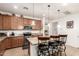 Well-equipped kitchen with stainless steel appliances, granite countertops, and a functional center island at 2324 W Melody Dr, Phoenix, AZ 85041