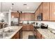 Stylish kitchen featuring stainless steel appliances, granite counters, and beautiful cabinetry at 2324 W Melody Dr, Phoenix, AZ 85041