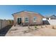 A lovely backyard with a patio and minimalist desert landscaping on a clear and sunny day at 23362 W Atlanta Ave, Buckeye, AZ 85326
