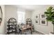 Functional home office with built-in bookshelves, a desk, and decorative artwork at 23362 W Atlanta Ave, Buckeye, AZ 85326