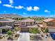 Expansive aerial view of a two-story home with mountain views and blue skies at 2387 E Runaway Bay Pl, Gilbert, AZ 85298