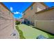 Backyard features a green putting area, great for relaxing and fun outdoor recreation at 2387 E Runaway Bay Pl, Gilbert, AZ 85298