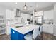Well-equipped kitchen with a large island, stylish pendant lighting, and ample counter space at 2387 E Runaway Bay Pl, Gilbert, AZ 85298