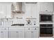 Close-up of a modern kitchen with white subway tile backsplash and stainless steel appliances at 2387 E Runaway Bay Pl, Gilbert, AZ 85298