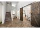 Spacious living room with stairs and barn doors at 2387 E Runaway Bay Pl, Gilbert, AZ 85298