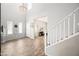 Bright living room with high ceilings, neutral tones, and elegant chandelier at 2387 E Runaway Bay Pl, Gilbert, AZ 85298
