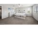 Light-filled main bedroom with a ceiling fan, natural light, and tasteful decor at 2387 E Runaway Bay Pl, Gilbert, AZ 85298