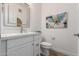Stylish powder room featuring modern vanity, contemporary mirror, and elegant fixtures at 2511 W Queen Creek Rd # 174, Chandler, AZ 85248