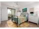 Comfortable bedroom featuring an outdoor patio and lots of natural light at 2511 W Queen Creek Rd # 174, Chandler, AZ 85248