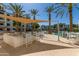 Outdoor grill area with a granite countertop, built-in grill, and seating, perfect for outdoor cooking at 2511 W Queen Creek Rd # 174, Chandler, AZ 85248