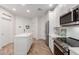 Bright kitchen featuring white cabinetry, stainless appliances, and a kitchen island at 2511 W Queen Creek Rd # 174, Chandler, AZ 85248