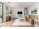 Cozy living room with comfortable seating, a ceiling fan, and access to a patio at 2511 W Queen Creek Rd # 174, Chandler, AZ 85248