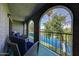 Relaxing balcony with seating overlooking a scenic water view and mature trees at 2524 S El Paradiso Dr # 82, Mesa, AZ 85202