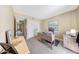 This cozy bedroom features neutral colored walls, carpet, large closet, and a desk for a home office at 2524 S El Paradiso Dr # 82, Mesa, AZ 85202