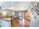 Bright dining room with wood-look floors, ceiling fan, and access to outdoor balcony at 2524 S El Paradiso Dr # 82, Mesa, AZ 85202